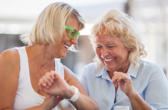 two older women laughing together