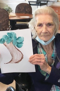 Springfield resident with her potato painting