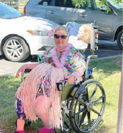 Springfield Resident dressed up for the Luau in her hula skirt and floral blouse